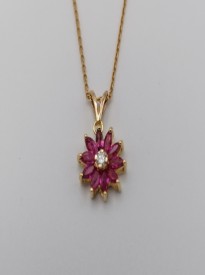 Flower design with Ruby & a piece of Diamond